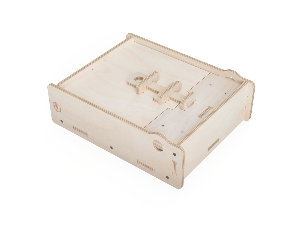 Flat-packed CNC-cut chisel box parts assembled into a functional tool storage unit