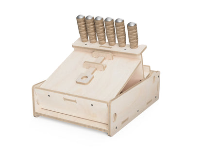Wooden chisel organizer box displaying angled tool compartments for easy access