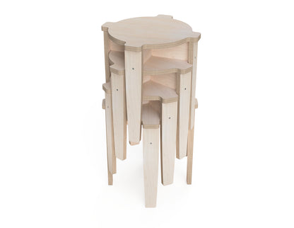 Multiple stackable wooden stools stored vertically