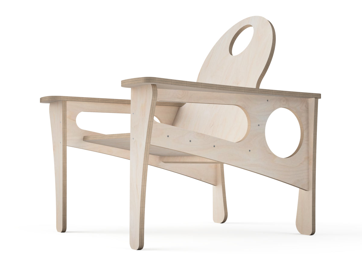 A minimalist light natural wood chair with a sculptural design, featuring circular cutouts in the backrest and side panel, set against a plain white background.