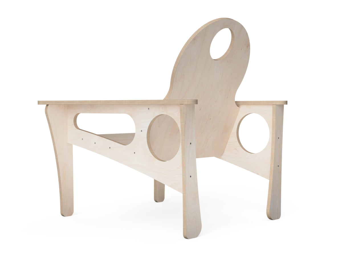 A minimalist, light natural wood chair with unique circular cutouts in the backrest, armrests, and base, shown on a solid white background.