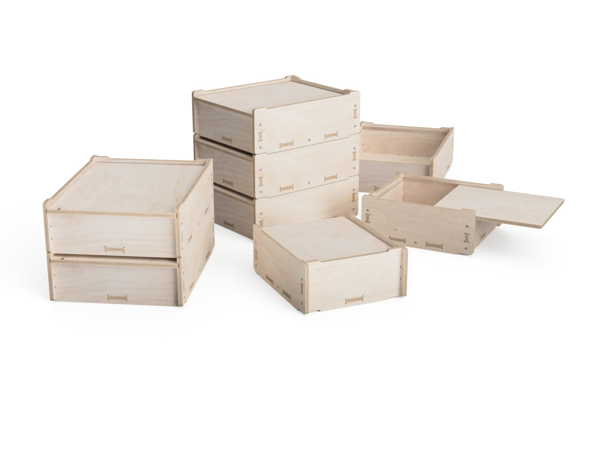 Three CNC plywood storage boxes stacked together