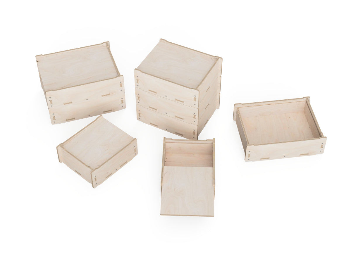 Finished CNC storage boxes stacked for organized workshop storage
